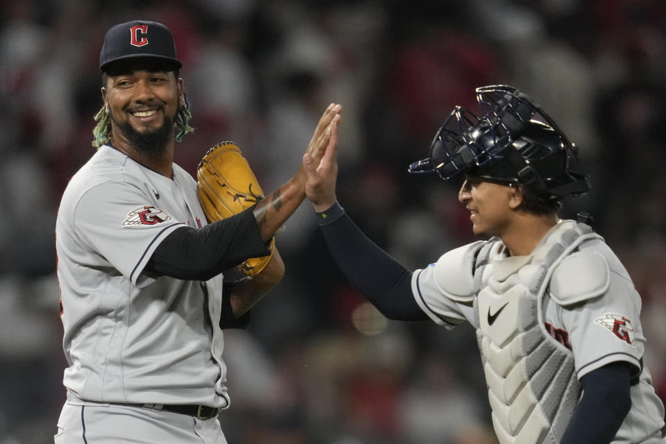 Cleveland Guardians relief pitcher Emmanuel Clase, left, and catcher Bo Naylor celebrate after a 6-3 win over the Los Angeles Angels in a baseball game in Anaheim, Calif., Friday, Sept. 8, 2023. (AP Photo/Ashley Landis)