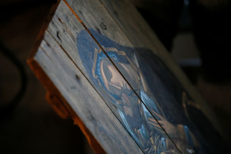 An icon painted on wooden planks from ammunition boxes is pictured at a studio in Kyiv