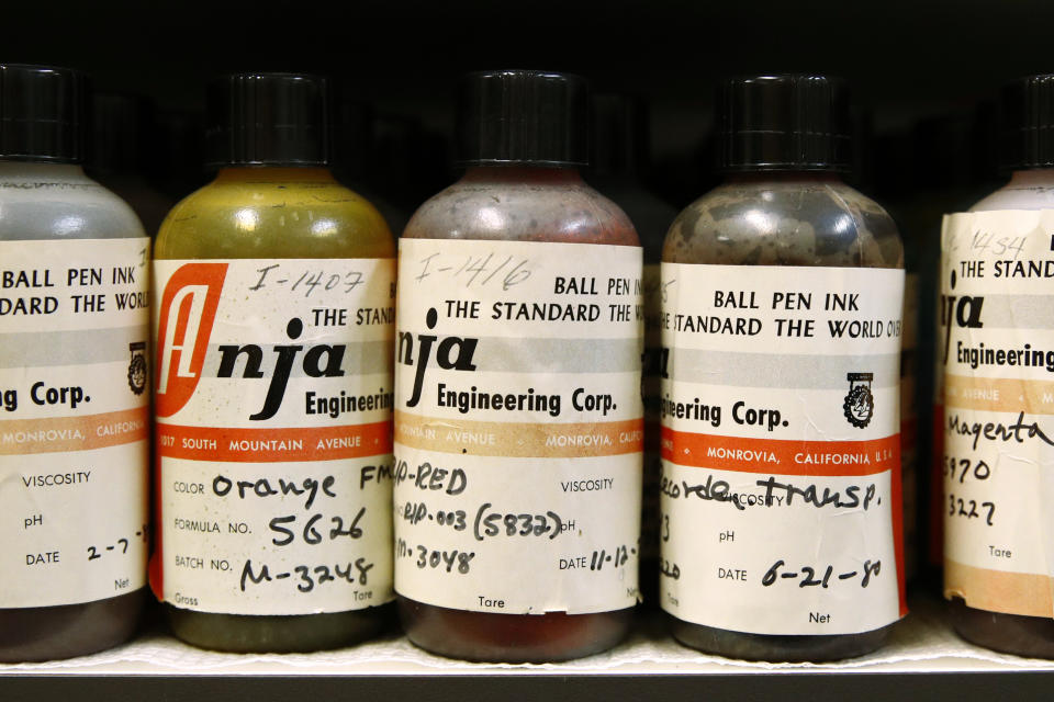 In this June 27, 2019 photo, ink samples collected by former U.S. Secret Service chief chemist Antonio Cantu sit on a shelve in a newly-dedicated International Ink Library in remembrance of Cantu at the Secret Service headquarters building in Washington. The library contains more than 15,000 samples of pen, marker and printer inks dating back to the 1920s. (AP Photo/Patrick Semansky)