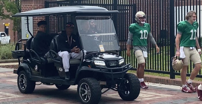 Jordan Travis returns to Florida State football practice on a golf cart on Nov. 22, 2023 following a season-ending injury last week against North Alabama.