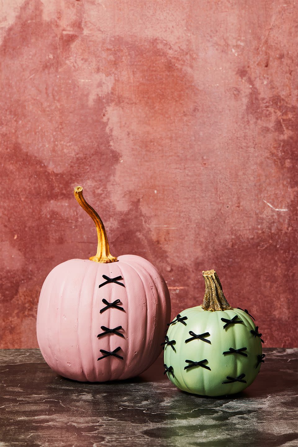 <p>We love how add just a few black bows can turn an ordinary painted pumpkin into something so unique. To get started, cut equal lengths of ribbon (ours were about 5 inches) and tie into bows (you can also use pre-made bows). Then, place a tiny dot of hot glue onto the pumpkin and place the bow on top. Let dry and repeat all over surface of the pumpkin.</p><p><a class="link " href="https://www.amazon.com/gp/product/B00XN3TKOS?tag=syn-yahoo-20&ascsubtag=%5Bartid%7C10055.g.1714%5Bsrc%7Cyahoo-us" rel="nofollow noopener" target="_blank" data-ylk="slk:SHOP PRE-MADE BOWS;elm:context_link;itc:0;sec:content-canvas">SHOP PRE-MADE BOWS</a></p>