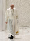 Pope Francis arrives to attend his weekly general audience in the Paul VI hall at the Vatican, Wednesday, Aug. 4, 2021. It was Francis' first general audience since undergoing planned surgery to remove half his colon for a severe narrowing of his large intestine on July 4, his first major surgery since he became pope in 2013. (AP Photo/Riccardo De Luca)