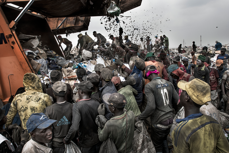 <p>Wasteland: People wait to sort through waste for recyclable and saleable material, as a garbage truck arrives at the Olusosun landfill, in Lagos, Nigeria, Jan. 21, 2017.<br>Humans are producing more waste than ever before. According to research by the World Bank, the world generates 3.5 million tonnes of solid waste a day, ten times the amount of a century ago. Rising population numbers and increasing economic prosperity fuel the growth, and as countries become richer, the composition of their waste changes to include more packaging, electronic components and broken appliances, and less organic matter. Landfills and waste dumps are filling up, and the World Economic Forum reports that by 2050 there will be so much plastic floating in the world’s oceans that it will outweigh the fish. A documentation of waste management systems in metropolises across the world investigates how different societies manage — or mismanage — their waste. (Photo: Kadir van Lohuizen/NOOR Images) </p>