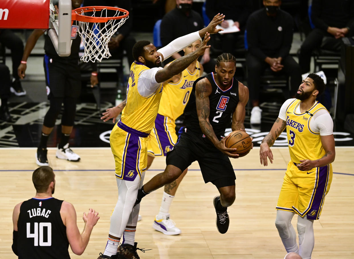 LOS ANGELES, CALIFORNIA - MAY 06: Kawhi Leonard #2 of the LA Clippers attempts a pass between Andre Drummond #2 and Anthony Davis #3 of the Los Angeles Lakers during the first quarter at Staples Center on May 06, 2021 in Los Angeles, California. NOTE TO USER: User expressly acknowledges and agrees that, by downloading and or using this photograph, User is consenting to the terms and conditions of the Getty Images License Agreement. (Photo by Harry How/Getty Images)