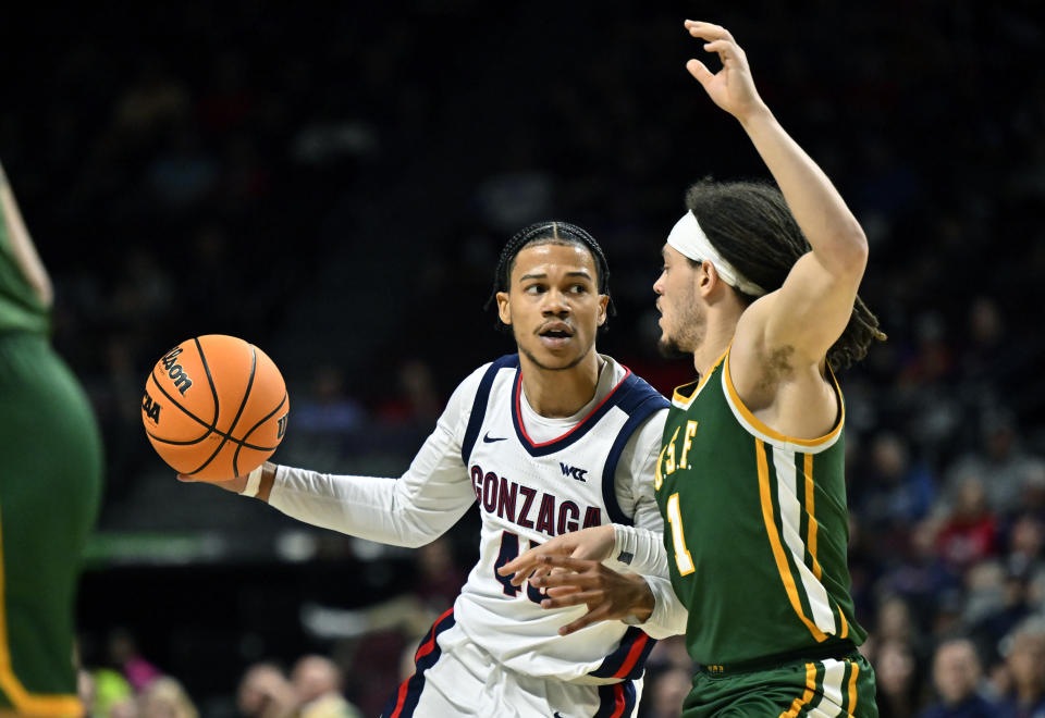 Gonzaga guard Rasir Bolton (45) looks to pass against San Francisco guard Tyrell Roberts during the second half of an NCAA college basketball game in the semifinals of the West Coast Conference men's tournament Monday, March 6, 2023, in Las Vegas. (AP Photo/David Becker)