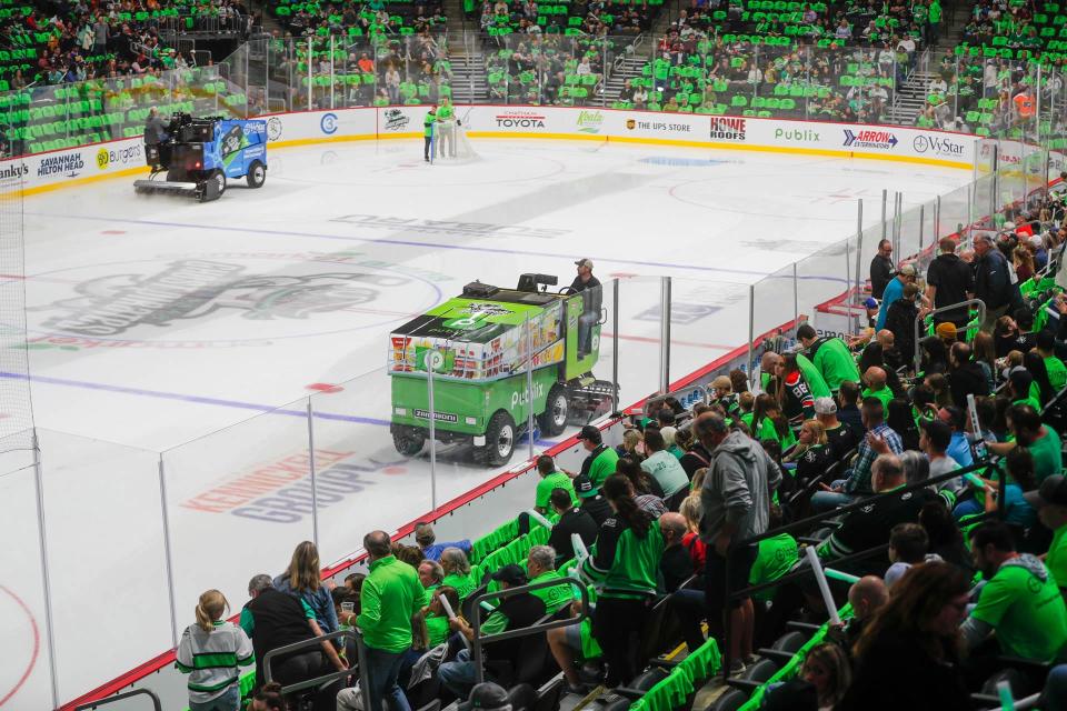 Fans watch as a pair of electric powered Zambonis prepare the ice for the Savannah Ghost Pirates home opener on November 5, 2022.