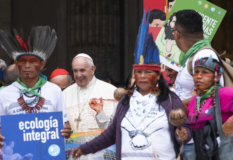 Pope Francis walks in procession on the occasion of the Amazon synod at the Vatican, Monday, Oct. 7, 2019. Pope Francis opened a three-week meeting on preserving the rainforest and ministering to its native people as he fended off attacks from conservatives who are opposed to his ecological agenda. (Claudio Peri/ANSA via AP)