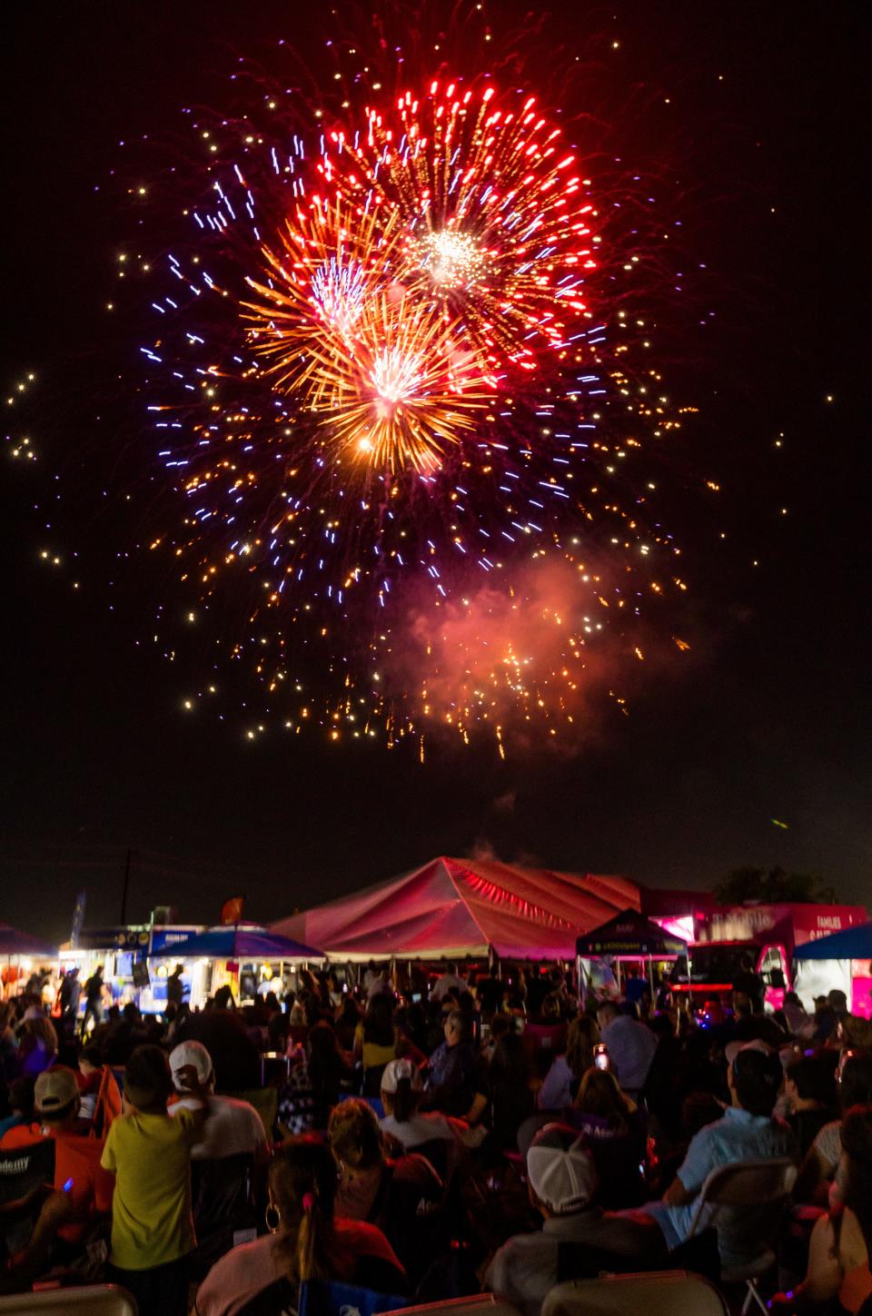 Attendees enjoy the fireworks show at the City of Socorro's Independence Extravaganza on Saturday, July 1, 2023, at Cougar Park in Socorro, Texas.