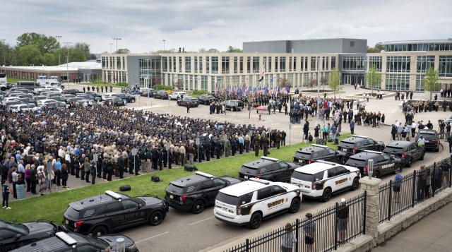 Over a thousand law enforcement officers from around the U.S. gather for the funeral service for St. Croix County Sheriff’s Deputy Kaitlin “Kaitie” R. Leising, Friday, May 12, 2023 in Hudson, Wis.. Hundreds of law enforcement officers from several states joined other mourners in paying final respects Friday to a Wisconsin sheriff’s deputy who was fatally shot by a suspected drunken driver during a traffic stop. (Glen Stubbe/Star Tribune via AP)