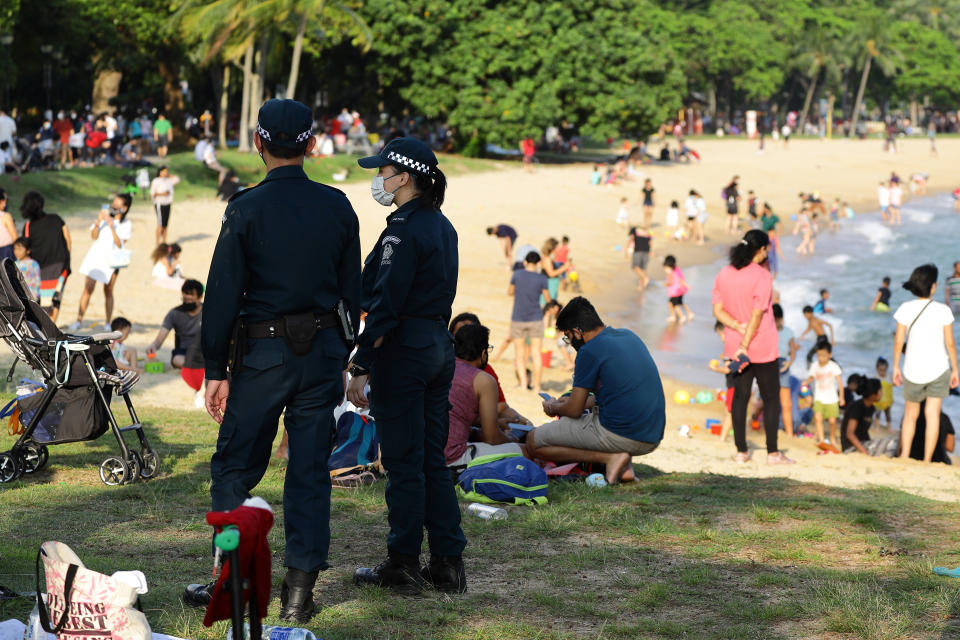 Auxillary police officers seen on duty at East Coast Park 25 December. (PHOTO: Getty Images)