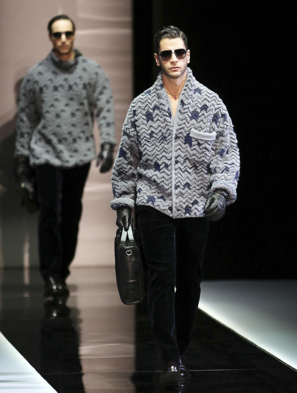 Models wear creations for Giorgio Armani men's Fall-Winter 2013-14 collection, part of the Milan Fashion Week, unveiled in Milan, Italy, Tuesday, Jan. 15, 2013. (AP Photo/Antonio Calanni)