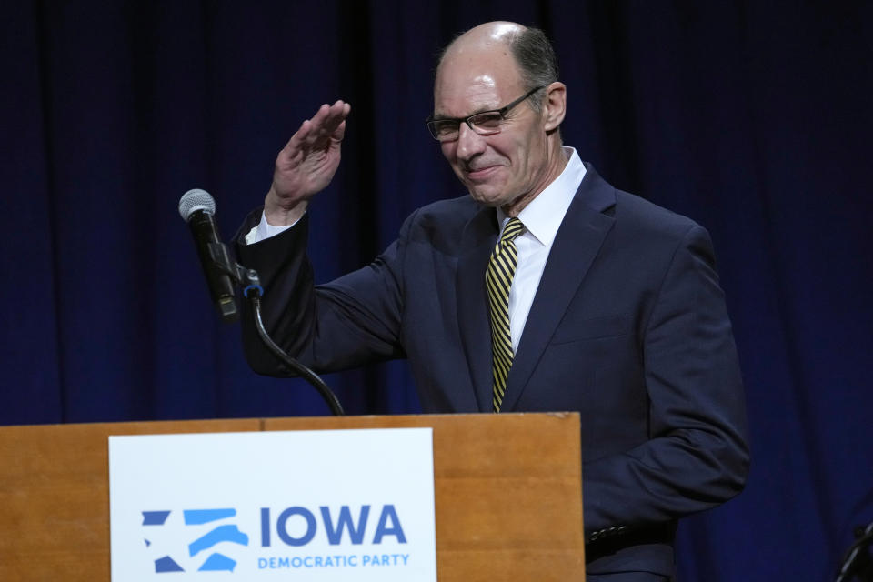 Retired Navy Admiral Mike Franken salutes before speaking at the Iowa Democratic Party's Liberty and Justice Celebration, Saturday, April 30, 2022, in Des Moines, Iowa. (AP Photo/Charlie Neibergall)