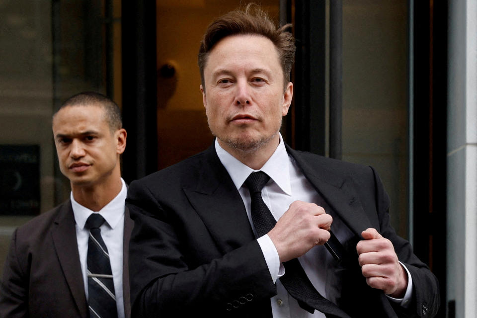 FILE PHOTO: Tesla CEO Elon Musk and his security detail depart the company's local office in Washington, U.S. January 27, 2023.  REUTERS/Jonathan Ernst//File Photo