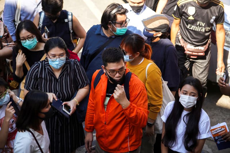 FILE PHOTO: Protest leaders arrive to report themselves at a police station in Bangkok