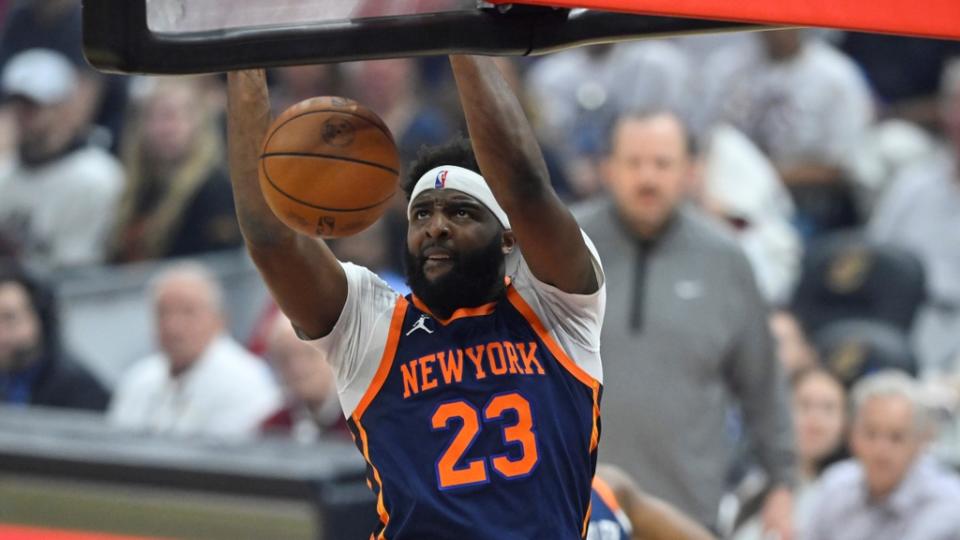 Apr 15, 2023; Cleveland, Ohio, USA; New York Knicks center Mitchell Robinson (23) dunks against the Cleveland Cavaliers in the first quarter of game one of the 2023 NBA playoffs at Rocket Mortgage FieldHouse. Mandatory Credit: David Richard-USA TODAY Sports