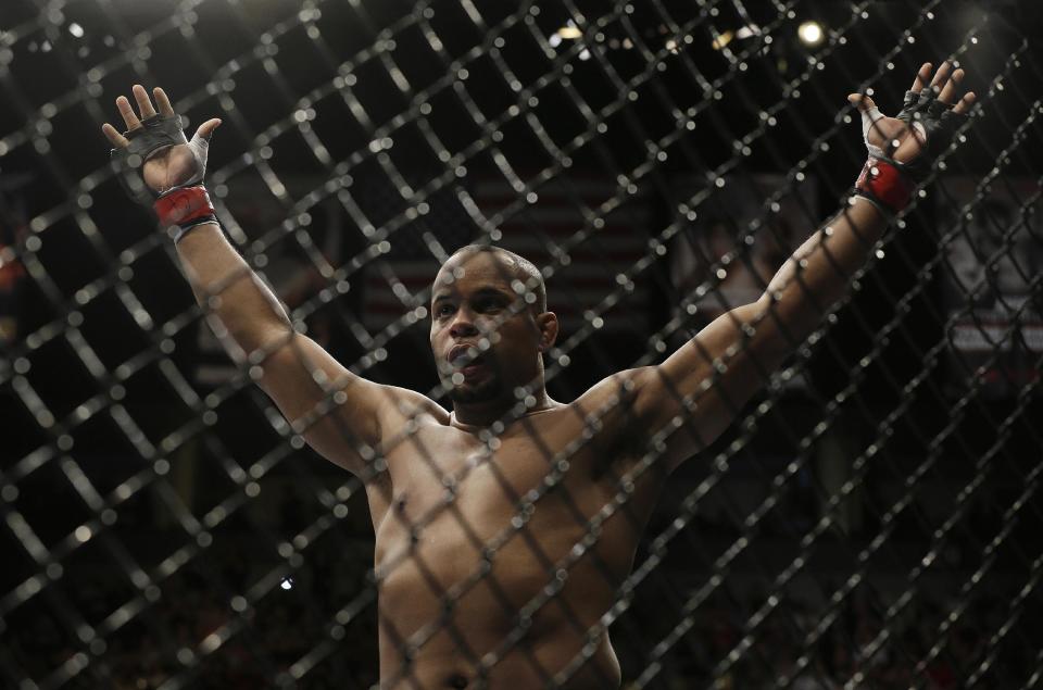 Daniel Cormier reacts after the referee stopped his UFC 170 mixed martial arts light heavyweight fight against Patrick Cummins on Saturday, Feb. 22, 2014, in Las Vegas. (AP Photo/Isaac Brekken)