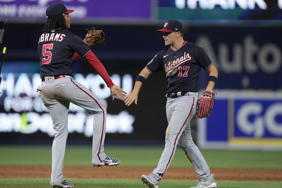 Washington Nationals shortstop CJ Abrams (5) and center fielder Alex Call (17) celebrate after the Nationals beat the Miami Marlins 7-4 in a baseball game, Friday, Aug. 25, 2023, in Miami. (AP Photo/Wilfredo Lee)