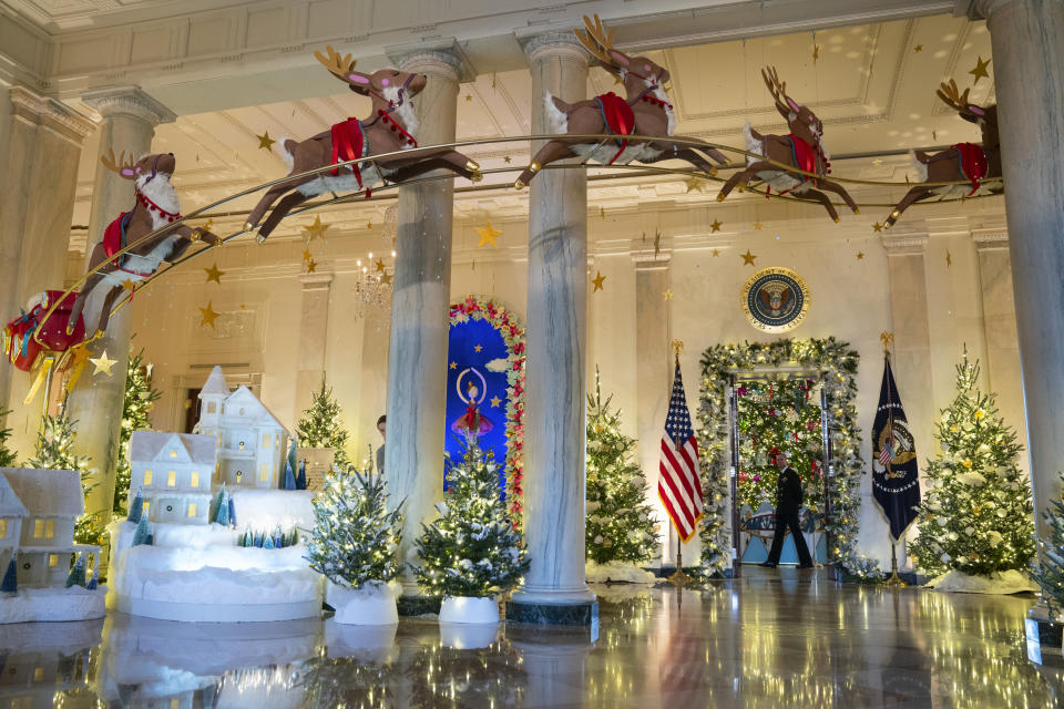 Holiday decorations adorn the Grand Foyer of the White House for the 2023 theme "Magic, Wonder, and Joy," Monday, Nov. 27, 2023, in Washington. (AP Photo/Evan Vucci)