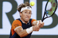 Norway's Casper Ruud plays a shot against Denmark's Holger Rune during their quarterfinal match of the French Open tennis tournament at the Roland Garros stadium in Paris, Wednesday, June 7, 2023. (AP Photo/Jean-Francois Badias)