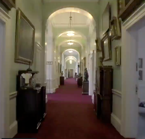 Just one of the many long corridors the staff must walk in Buckingham Palace. Source: Twitter/The Royal Family