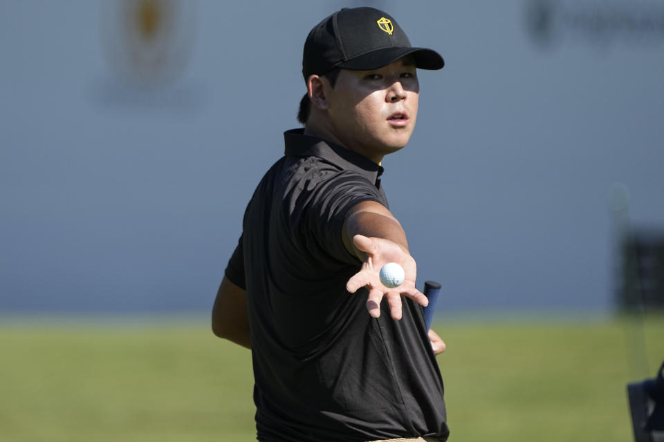 Si Woo Kim, of South Korea, stands on the fifth fairway during practice for the Presidents Cup golf tournament at the Quail Hollow Club, Tuesday, Sept. 20, 2022, in Charlotte, N.C. (AP Photo/Chris Carlson)