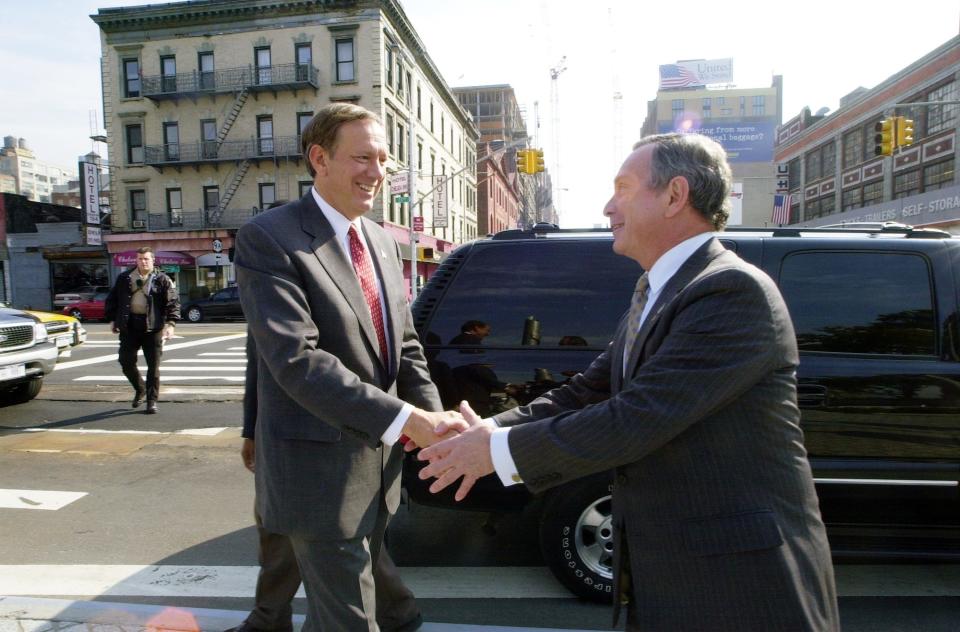 Gov. George Pataki shakes hands with Michael Bloomberg as he endorses the Republican mayoral candidate at Hudson River Park.