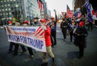 Supporters of U.S. President Donald Trump march ahead of the inauguration of President-elect Joe Biden, in Tokyo