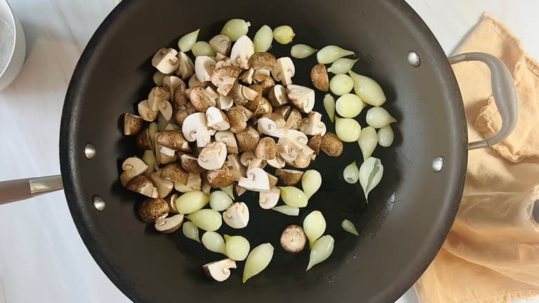 onions and mushrooms in pan