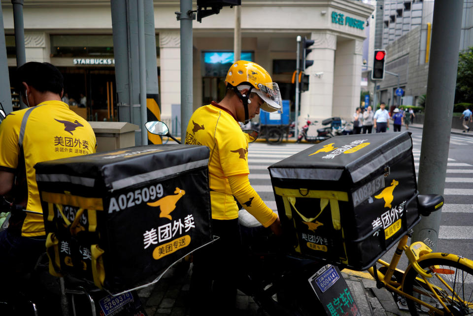 Drivers of food delivery service Meituan are seen in Shanghai, China June 25, 2018. REUTERS/Aly Song