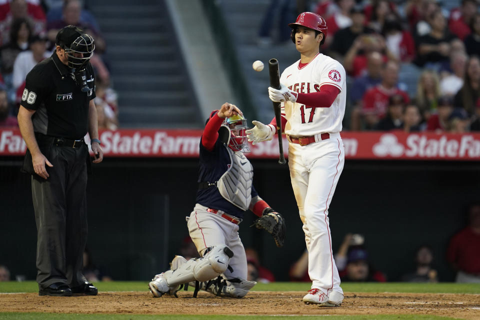 Los Angeles Angels designated hitter Shohei Ohtani (17) reacts after swinging a strike during the fourth inning of a baseball game against the Boston Red Sox in Anaheim, Calif., Monday, June 6, 2022. (AP Photo/Ashley Landis)