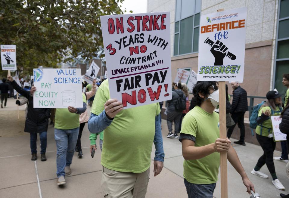 Striking members of the California Association of Professional Scientists march in Sacramento, Calif., Wednesday, Nov. 15, 2023. Thousands of scientists who work for California have begun a three-day strike over lack of progress on contract talks. (Paul Kitagaki Jr./The Sacramento Bee via AP)