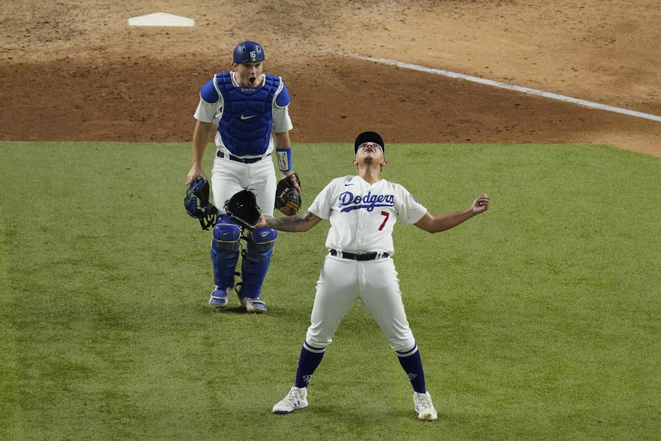 Los Angeles Dodgers starting pitcher Julio Urias celebrates their win against the Atlanta Braves in Game 7 of a baseball National League Championship Series Sunday, Oct. 18, 2020, in Arlington, Texas. (AP Photo/Sue Ogrocki)