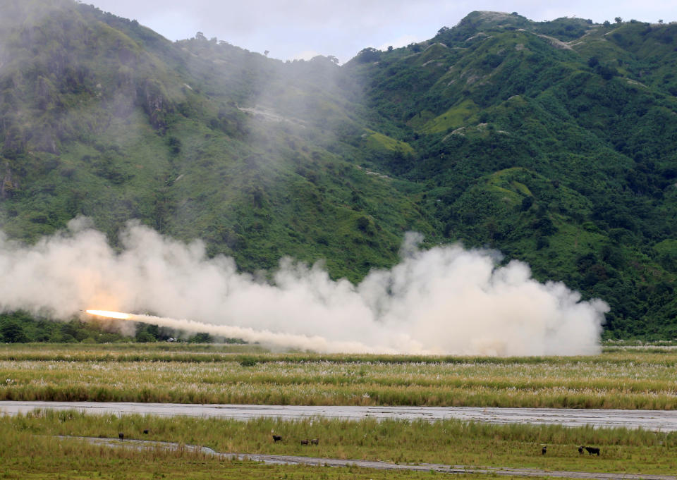 U.S. military forces fire a High Mobility Artillery Rocket System (HIMARS) rocket during the annual  Philippines-US live fire amphibious landing exercise (PHIBLEX) at Crow Valley in Capas, Tarlac province, north of Manila, Philippines October 10, 2016. REUTERS/Romeo Ranoco  