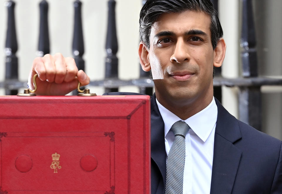 Chancellor of the exchequer, Rishi Sunak stands with the Budget Box outside 11 Downing Street ahead the budget on 3 March in London, England. Photo: Karwai Tang/Getty Images