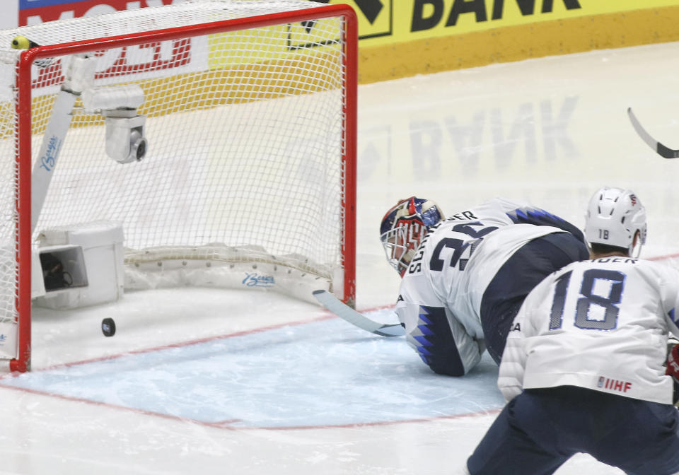 Goaltender Cory Schneider of the US fails to stop a shot by Russia's Kirill Kaprizov during the Ice Hockey World Championships quarterfinal match between Russia and the United States at the Steel Arena in Bratislava, Slovakia, Thursday, May 23, 2019. (AP Photo/Ronald Zak)