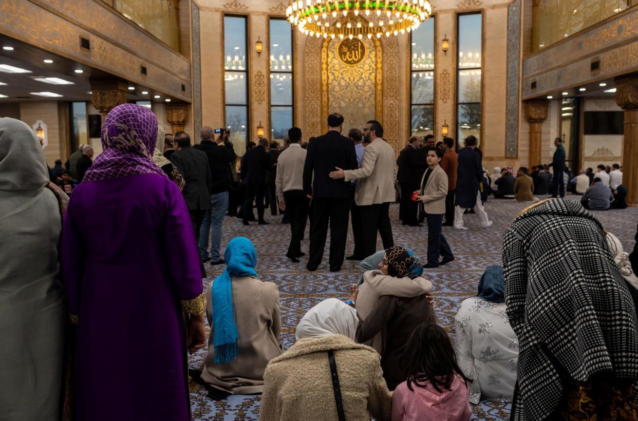 Farrah Ansari hugs a friend before the prayer starts inside the Islamic Association of Greater Detroit's (IAGD) newly expanded mosque in Rochester Hills on Saturday, March 2, 2024. Ansari is the daughter of one of the founding members who helped form the mosque more than 40 years ago.