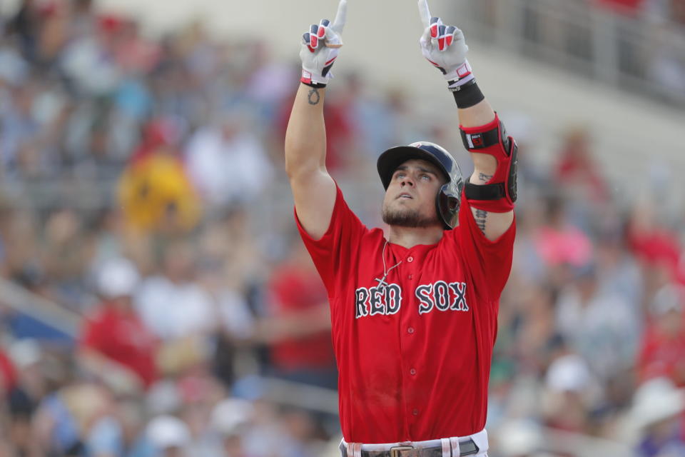 Boston Red Sox Michael Chavis reacts as he crosses home plate hitting an 3-run home run in the third inning of their spring training baseball game against the New York Yankees in Fort Myers, Fla., Saturday, Feb. 23, 2019. (AP Photo/Gerald Herbert)