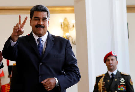 Venezuela's President Nicolas Maduro smiles to the media after a meeting with former Spanish Prime Minister Jose Luis Rodriguez Zapatero at the presidential palace in Caracas, Venezuela May 18, 2018. Zapatero will be an observer in the upcoming May 20 election. REUTERS/Carlos Jasso