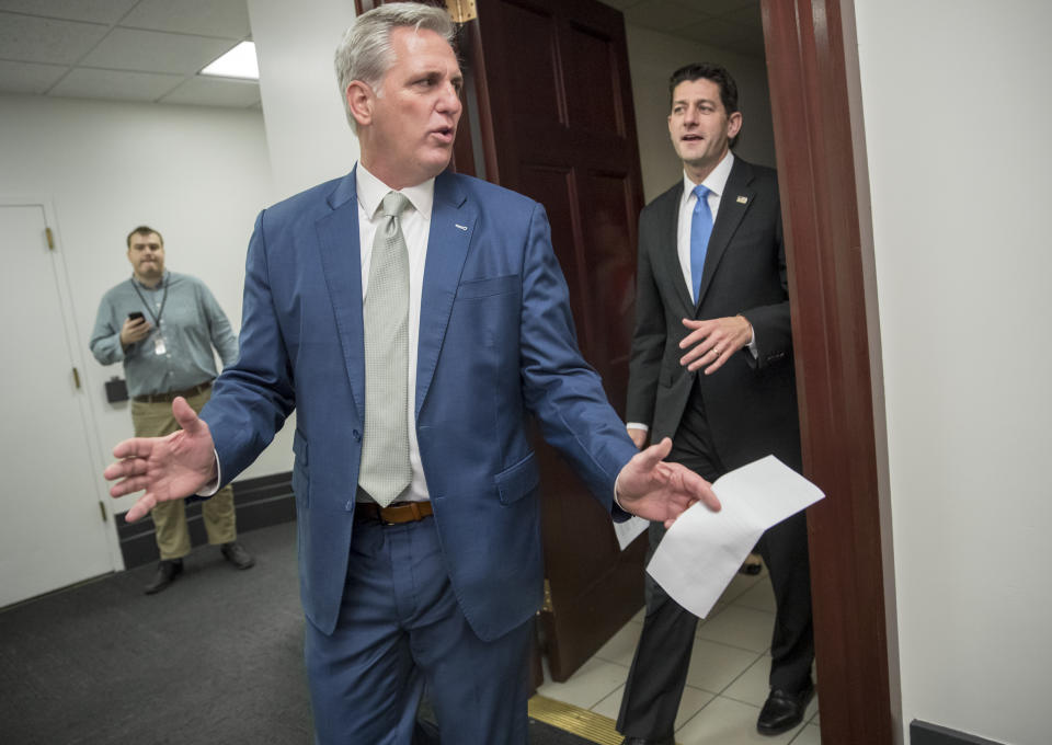 Majority Leader Kevin McCarthy, R-Calif., left, and Speaker of the House Paul Ryan, R-Wis., leave a closed-door Republican Conference meeting as Congress prepares to vote on the biggest reshaping of the U.S. tax code in three decades, on Capitol Hill, in Washington, Tuesday, Dec. 19, 2017. After passing the measure on Tuesday afternoon, House members will have to re-vote on Wednesday before sending the bill to the Senate. (AP Photo/J. Scott Applewhite)