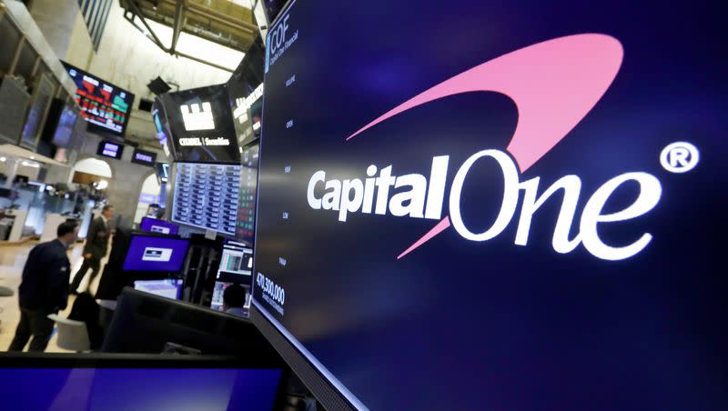 The logo for Capital One Financial is displayed above a trading post on the floor of the New York Stock Exchange, July 30, 2019. Capital One Financial is buying Discover Financial Services for $35 billion, in a deal that would bring together two of the nation’s biggest lenders and credit card issuers, according to a news release issued by the companies Monday, Feb. 19, 2024.