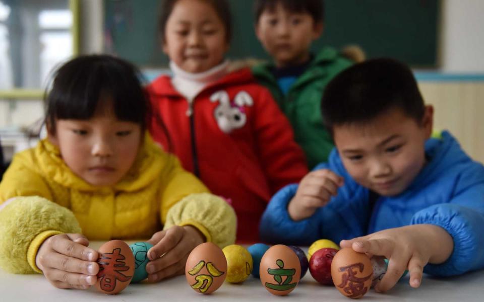 <p>Children enjoy standing eggs on end to celebrate the spring equinox in China, where legend says it's easier to balance them on this day.</p>