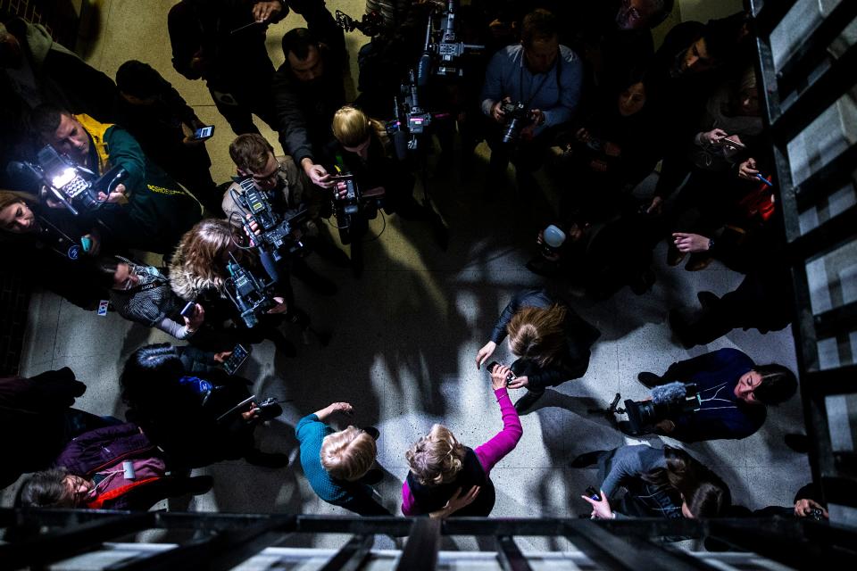 U.S. Sen. Elizabeth Warren, D-Mass., greets caucus goers at Roosevelt High School on Monday, Feb. 3, 2020, in Des Moines. 