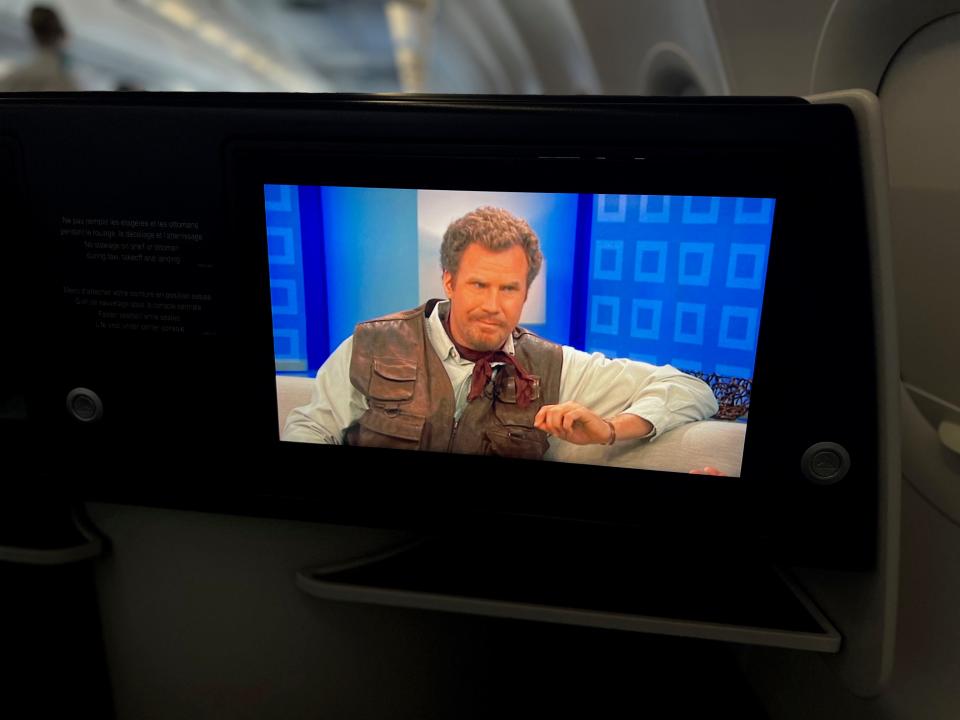 Flying on La Compagnie all-business class airline from Paris to New York — Land of the Lost playing.