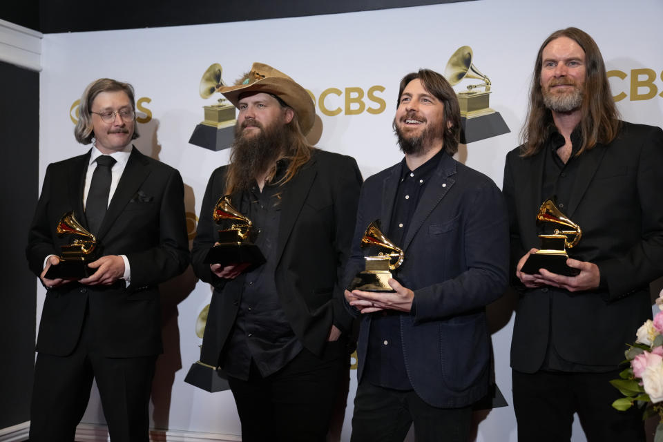 J.T. Cure, from left, Chris Stapleton, Dave Cobb, and Derek Mixon, winners of the award for best country song for "Cold," pose in the press room at the 64th Annual Grammy Awards at the MGM Grand Garden Arena on Sunday, April 3, 2022, in Las Vegas. (AP Photo/John Locher)