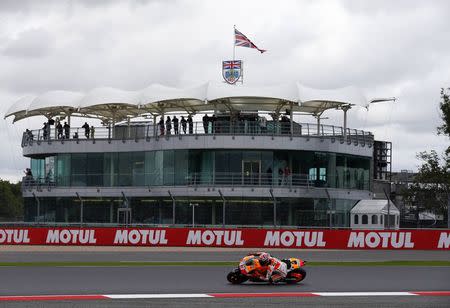 Honda MotoGP rider Marc Marquez of Spain takes a corner during the qualifying session for the British Grand Prix at the Silverstone Race Circuit, central England, August 30, 2014. REUTERS/Darren Staples