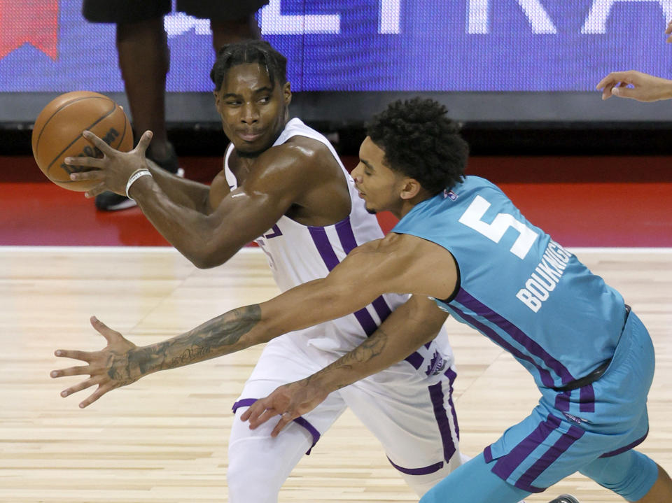 Sacramento Kings guard Davion Mitchell is pressured by Charlotte Hornets guard James Bouknight during the 2021 NBA Summer League at the Thomas & Mack Center in Las Vegas on Aug. 9, 2021. (Ethan Miller/Getty Images)