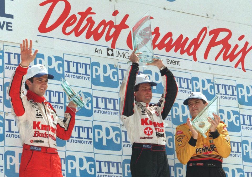 KMart/Budweiser driver Christian Fittipaldi, left, KMart/Texaco driver Michael Andretti and Pennzoil driver Gil de Ferran stand on the 1996 victory stand for the Detroit Grand Prix on Belle Isle.