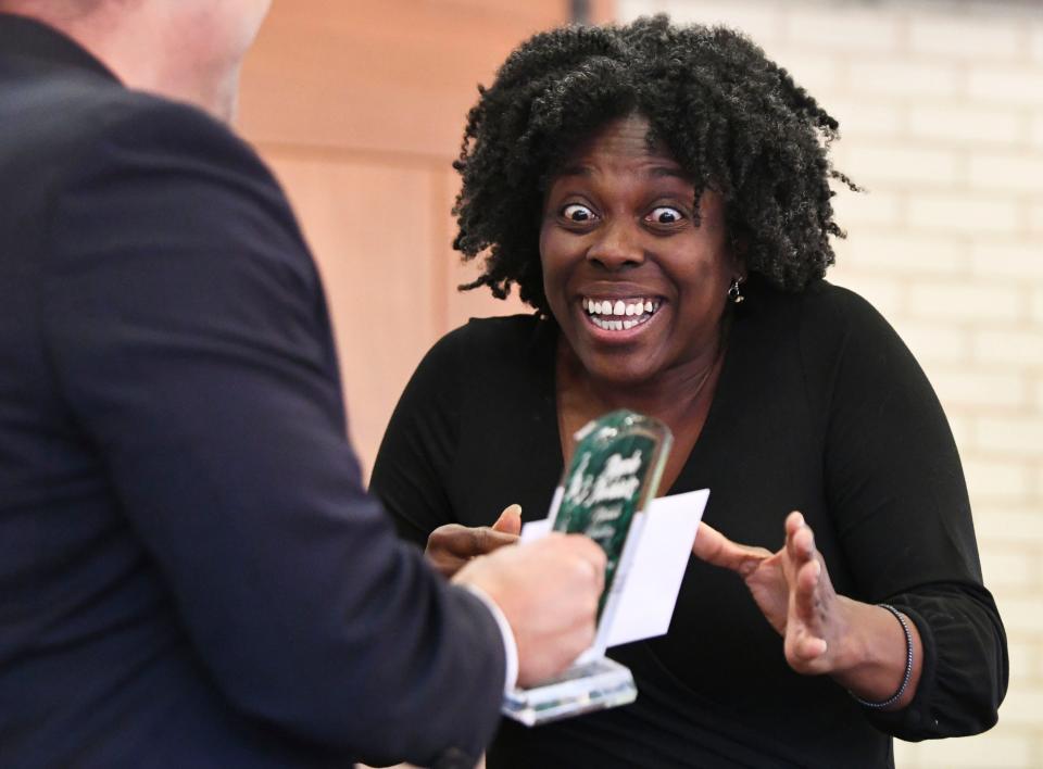 Dec 5, 2022; Tuscaloosa, Alabama, USA;  The Tuscaloosa City Schools presented the 2022 Apple Award Winners for teachers and support personnel at the Tuscaloosa River Market. Nichole Redding from Woodland Forrest Elementary School reacts to being named the Support Employee of the Year, school winner.  