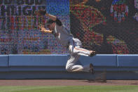 San Francisco Giants left fielder Austin Slater makes a catch on a ball hit by Los Angeles Dodgers' Corey Seager during the sixth inning of a baseball game Saturday, July 25, 2020, in Los Angeles. (AP Photo/Mark J. Terrill)