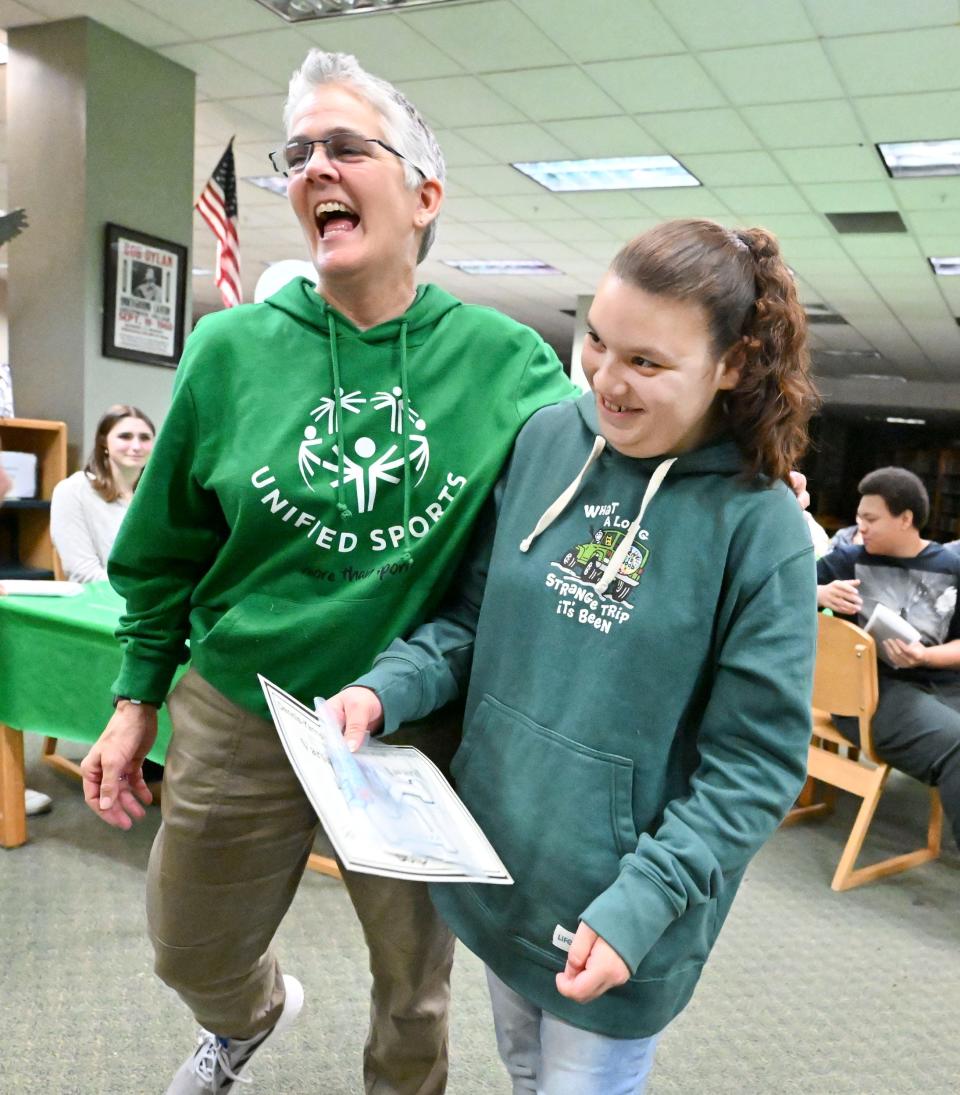 Jasmyn Cruz shares a moment with coach Traci Wyse after receiving her basketball letter during the Dennis-Yarmouth Unified Sports banquet on Dec. 13.